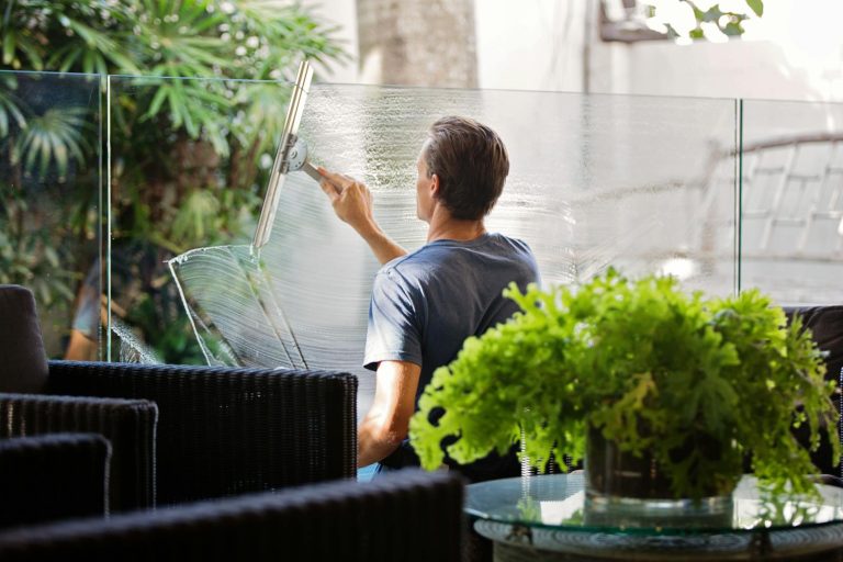 Window washer cleaning window